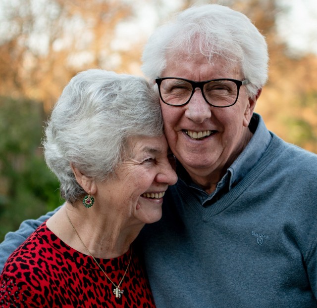 Senior couple laughing as they use dating slang